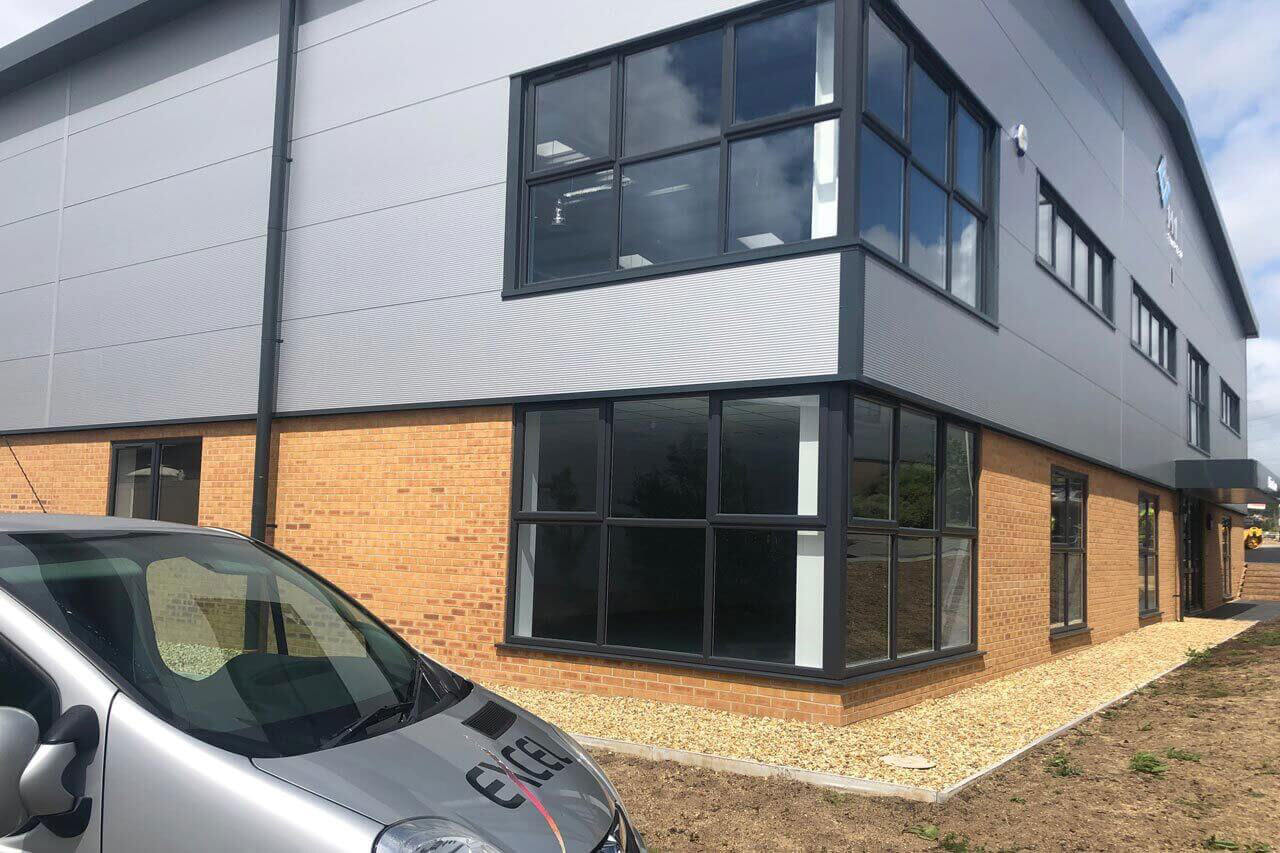 Excel Decorating van outside of a building